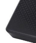 Close-up of Mini UPS 15600mAh Battery Backup for Router and Modem USA Plug showing textured surface design.
