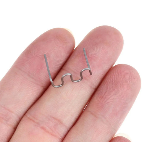 Healvian 100 Piece 0.8mm Wave Shaped Hot Car Bumper Repair Staples For Automotive Plastic Welding Kit in hand.