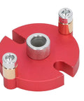 Red aluminum drill guide from Pro Grade Auto Centering Dowel Jig With Aluminum Drill Guide And Eight Drill Bushings.