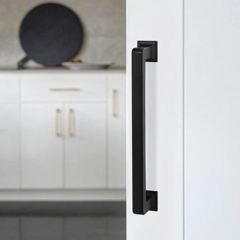 10 Pack Matte Black 5 Inch 128mm Cabinet Handles Zinc Alloy Drawer Pulls installed on white cabinet door in kitchen