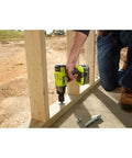 Person using the P1833 3-Speed 1/2-Inch Impact Wrench Kit With 4.0Ah Battery to secure wooden frame outdoors