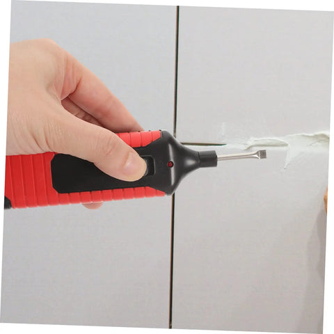 Hand using Tile Repair Kit For Porcelain And Marble Color Wax Blocks For Quick Scratch Chip Repair on a tile surface.