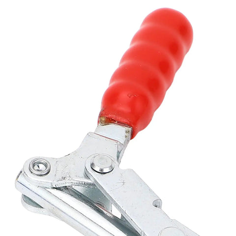 Close-up of red rubber handle of a Double Head Push Pull Toggle Clamp Securely Locks Welding, Saws And Molds For Rock Solid Build Quality And Quick Release Clamping Action On Any Shop Job.