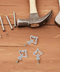 Heavy Duty Drywall Anchors And Screws Kit With Plastic Butterfly Hooks, 50 sets for hollow walls shown with tools on wood surface