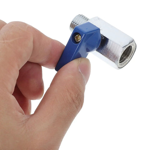 Hand holding One Quarter Inch NPT Solid Brass Mini Ball Valve Female Male Adapter With Easy Grip Lever Handle.