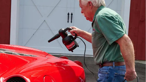 Person using Handheld Car Blower For Detailing And Cleaning, Electric Duster And Dust Buster For Cars, Clothes, Surfaces, 120V power