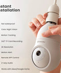 Person holding 2K Light Bulb Security Camera Wireless Outdoor Bulb Cam for Home Security, features listed with E27 socket.