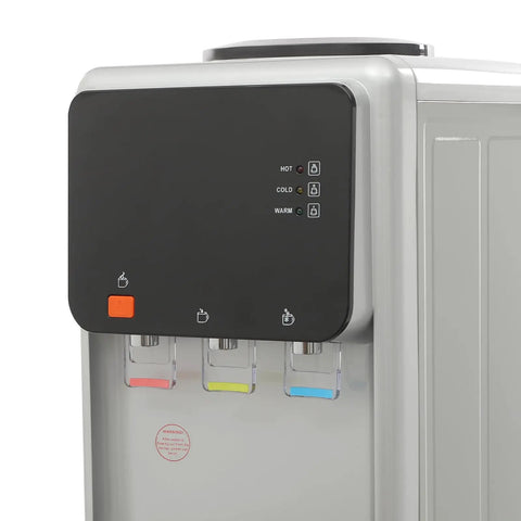 Close-up of Triple Temperature Water Dispenser with hot, cold, and room temperature faucets; freestanding electric cooler and heater.