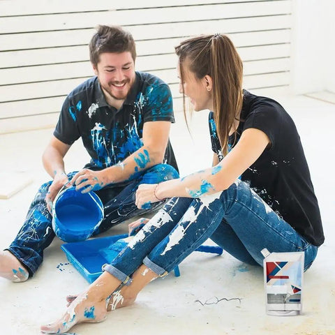 Couple working on DIY home project with Heavy Duty Concrete Crack Filler And Cement Repair Sealant in smooth grey packaging.