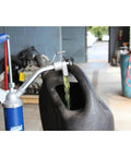 Lincoln 1340 Lever Action Barrel Pump For Industrial And Automotive Lubrication And Fluid Transfer in action at a workshop