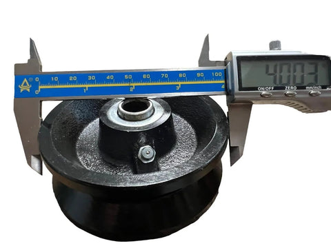 Measuring 4-inch cast iron v-groove gate wheel to confirm size