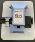Boss Level Mt 09 Fiber Cleaver Automatic Cable Cutting Knife For Ftth Installations top view on a transparent case.