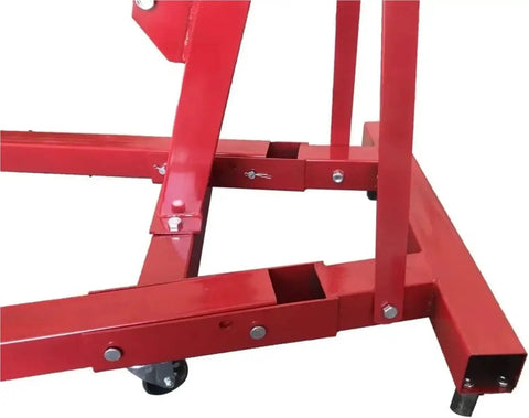 Close-up of the frame and wheels of the Top Shelf Folding Hydraulic Engine Hoist With Telescopic Boom 2 Ton Capacity Motor Crane.