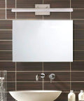 24 Inch Modern LED Vanity Light For Bathroom, Dimmable 24W, Brushed Nickel Finish above a sleek single-sink bathroom mirror