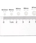 6mm Nylon Bearing Balls 25 Pack PA66 Solid Nylon Precision Bearing Balls For Bearings And Gears beside a metric ruler