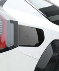 Fresh Glossy Black EV Charging Port Cover Trim Compatible With Kia EV9 2024 2025 2026 on vehicle side, showcasing sleek design.