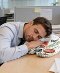 Man using U Shaped Memory Foam Travel Pillow For Airplane And Car, Ergonomic Neck Support, with mushroom and butterfly design in office