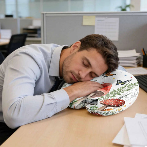 Man using U Shaped Memory Foam Travel Pillow For Airplane And Car, Ergonomic Neck Support, with mushroom and butterfly design in office