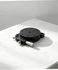 Insanely Steady Manual Precision Rotation Stage With Hella Smooth 60mm Aluminum Base and Ridiculously Precise Dial Control on marble surface.