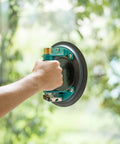 Hand using 8 Inch Vacuum Suction Cup For Granite And Glass Lifting with Metal Handle and Brass Pump on glass surface