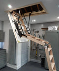 Premium Electric Attic Lift Stairs With No Sweat Remote Control Built Rugged Beech Wood Frame For Homes 7 Feet 10 Inches To 9 Feet 6 Inches Tall showing extended ladder from ceiling.