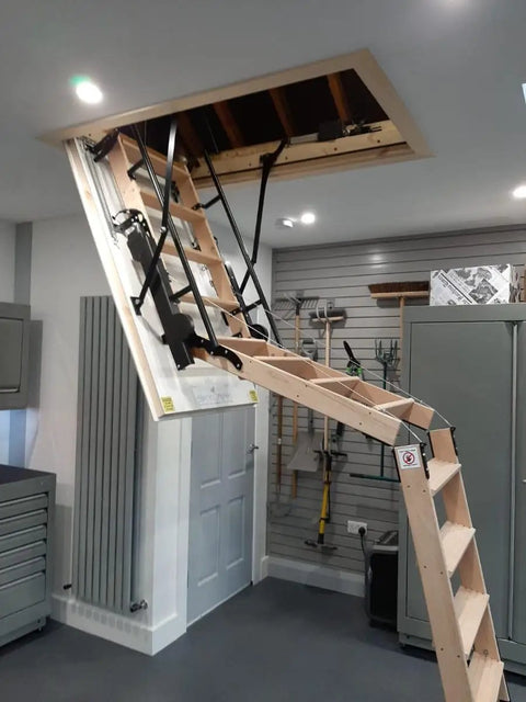 Top Shelf Electric Attic Pull Down Stairs With Wireless Remote Fits Ceilings 7Ft 8In To 9Ft 6In Beech Hardwood Tread revealed in attic.