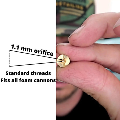 Close-up of hand holding 1.1mm Foam Cannon Orifice Nozzle Universal Fit Brass 2 Pack, showing standard threads for foam cannons.