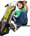 PowerRider 360 Drifting Trike Electric Ride On For Kids 9 MPH Top Speed With 40 Minute Run Time Dual Rear Caster Wheels For 360 Spins And Drifts Black Yellow, child riding