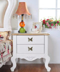 White dresser with two Pack Of 5 Vintage Butterfly Cabinet Door Knobs In Antique Bronze Finish With Retro Charm next to bed