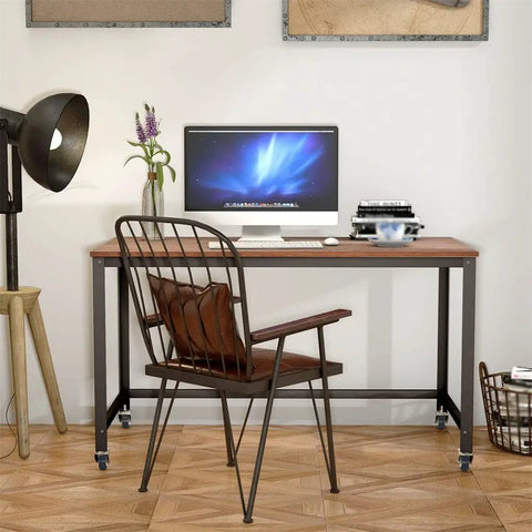 Smooth Ride Rolling Computer Desk With Lockable Wheels And Heavy Duty Steel Frame Portable Laptop Workstation Wide Wood Top in home office.