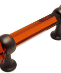 Oil Rubbed Bronze Cabinet Pull With Amber Glass Inset Handle, 3 Inch Hole Centers, shown in a side view.
