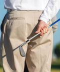 Golfer holding a tapered iron club with a 12 Pack Black Golf Ferrules For Tapered Irons, Fits 0.335 0.365 And 0.370 Shafts With Silver Ring.