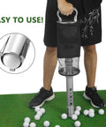 Person using Golf Ball Shag Bag With Detachable Aluminum Tube Holds Up To 70 Balls Ball Retriever on grass with golf balls.