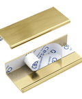 Six Pack Adhesive Cabinet Handles in gold finish showing peel and stick design with no drill installation, aluminum alloy, 100mm length.