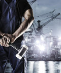 Person holding Dead Blow Mallet With Non-Rebounding Action, 60mm Head, 3.9 Lb Weight, ideal for heavy-duty impact.