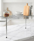 One Tier Steel Wire Shelving Unit With Adjustable Storage Rack Setup Measuring Thirty Inches By Fourteen Inches with plates and utensils.