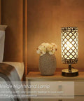 Crystal Table Lamps Set Of 2 With USB Charging Ports on a nightstand beside bed, with floral vase and warm light glow.