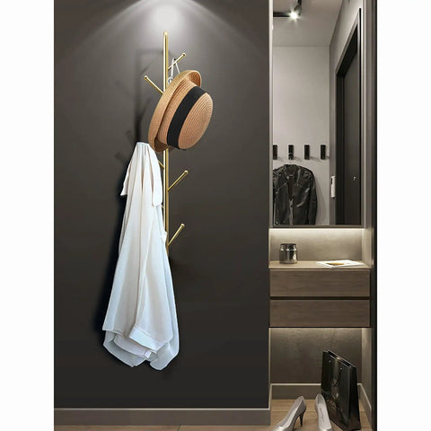 Sleek Modern Wall Mount Coat Rack Heavy Duty Entryway Storage Hook holding a white coat and a hat, angled view against a dark wall.