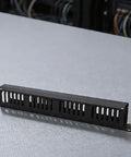 Rock Solid 24 Port Network Patch Panel For 19 Inch Rack Mount With Standard Rj45 Jacks Heavy Duty Cable Management Gear in black finish on a table.