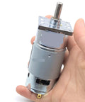 Compact 42Mm 25W Torque DC Gear Motor That Runs Smooth With Low Speed Operation For Robotics And Automation Projects Using 12V Or 24V Power Supply To Keep Things Reliable And Energy Efficient Without Overheating in hand.