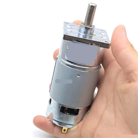 Compact 42Mm 25W Torque DC Gear Motor That Runs Smooth With Low Speed Operation For Robotics And Automation Projects Using 12V Or 24V Power Supply To Keep Things Reliable And Energy Efficient Without Overheating in hand.