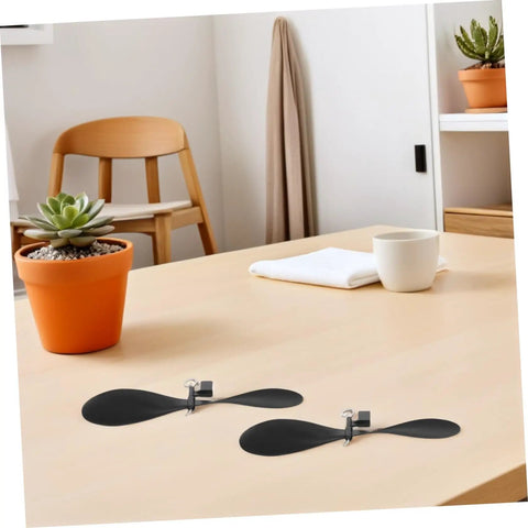10 Pack RC Airplane Propeller Set With 6x4mm Hole Diameter Fold Resistant Plastic Blades on a wooden table