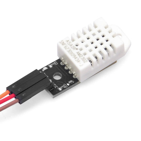Close-up of DHT22 AM2302 Digital Humidity and Temperature Sensor Module for Arduino and Raspberry Pi with wiring connectors visible.