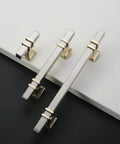 10 Pack 3 Inch Cabinet Handles In Brushed Nickel And Gold Finish shown on white and black surface