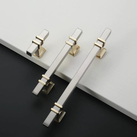 10 Pack 3 Inch Cabinet Handles In Brushed Nickel And Gold Finish shown on white and black surface