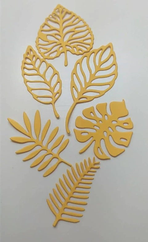 Totally Seven Piece Leaf Die Cut Set for Scrapbooking and Card Making shown with various plant leaf shapes on white background.