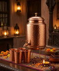 Copper Hammered Water Dispenser With Tap And Stand, Four Copper Glasses Included, 6.5 Liter Capacity for family gatherings.