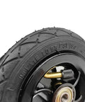 Five Inch Pneumatic Tire With Inner Tube And Heavy Duty Steel Hub Featuring 5X1 Bolt Pattern For Go Kart and Caster Wheels close up of tread and valve.