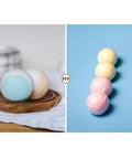 Two Hundred Piece Pack Of Slick Clear Heat Shrink Wrap Bags With Four Sizes for sealing bath bombs on a wooden plate.