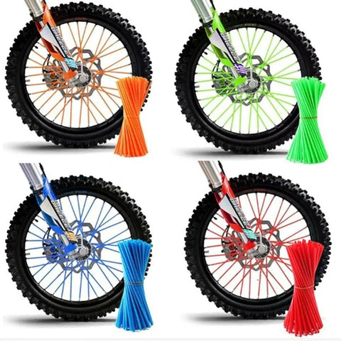 Four dirt bike wheels with 72Pcs Universal Spoke Skins Set For Dirt Bike BMX MTB And Motorcycle Wheels in various colors, 8-21 inch rims.